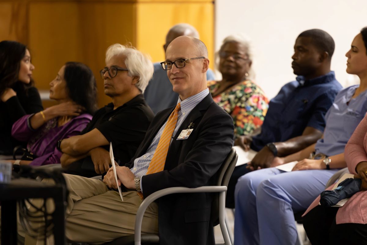 Dr. Scott Rogers and audience sitting  at the 2023 Honors and Awards Ceremony